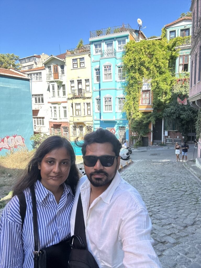 Tushar and Sanju in front of colourful houses in Balat, Istanbul