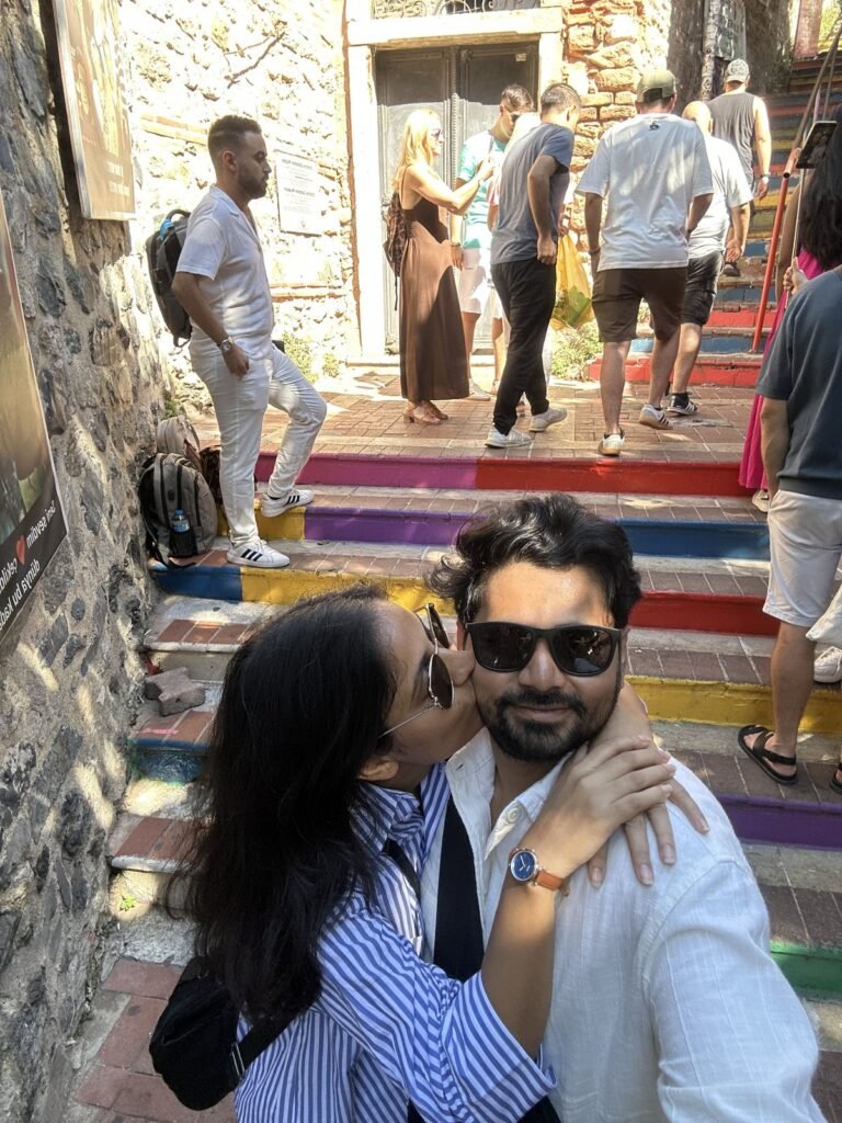 Tushar and Sanju on the rainbow stairs in Balat, Istanbul