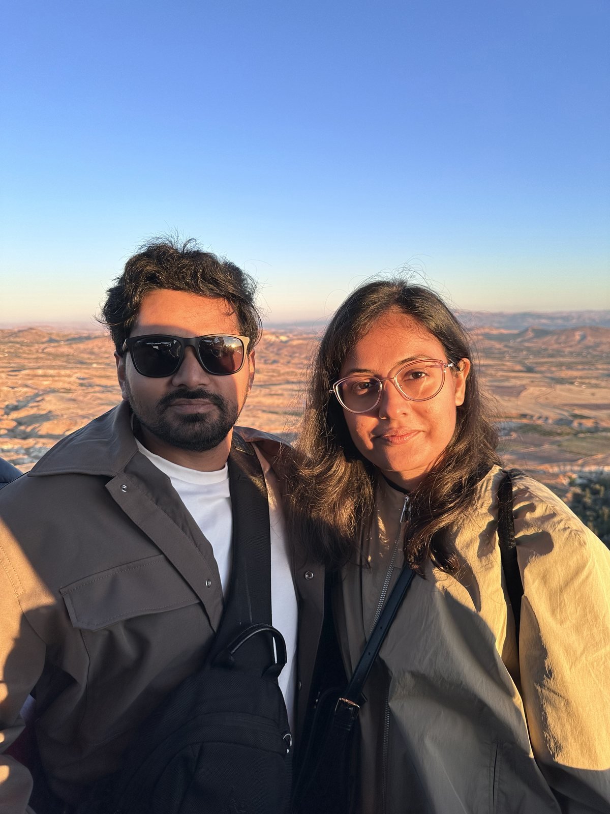Tushar and Sanju in a hot air balloon basket over Cappadocia at sunrise