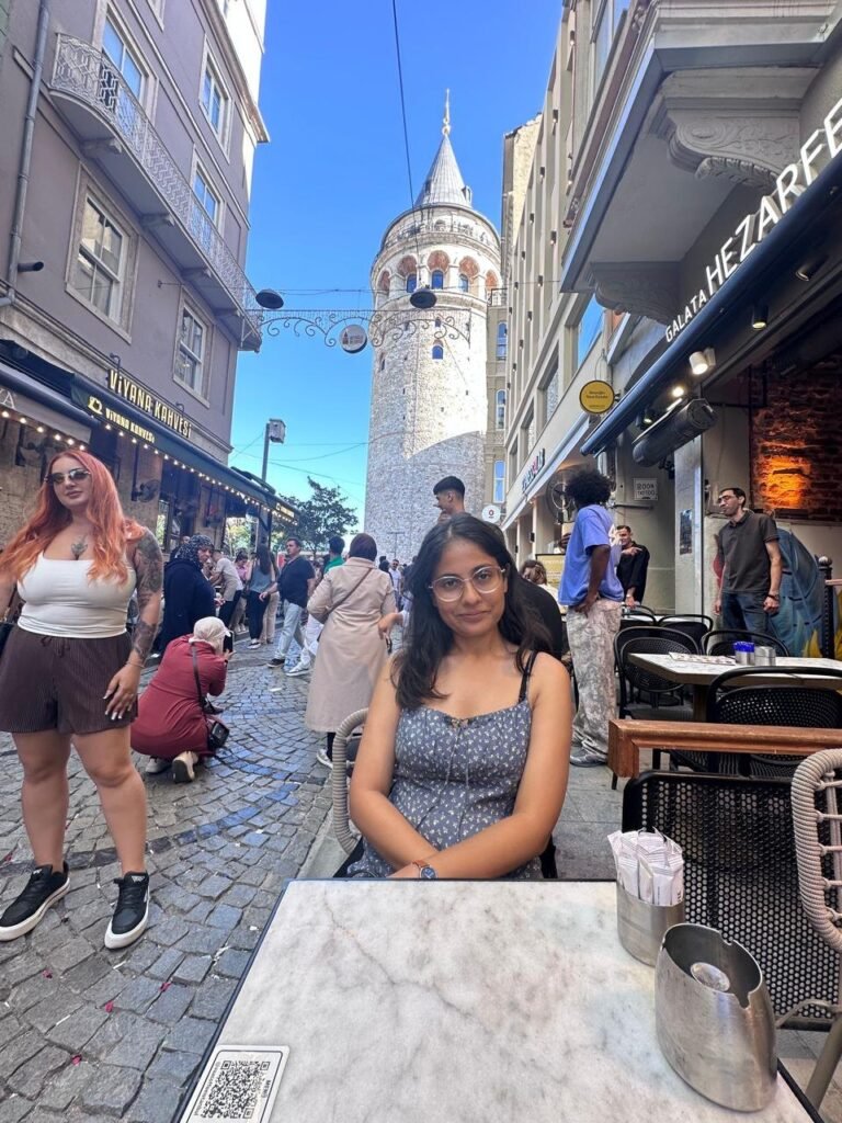Sanju at a café on the street leading up to Galata Tower