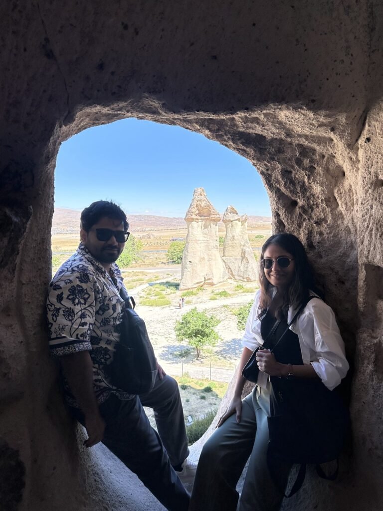 Tushar and Sanju in a rock window at Paşabağ, Cappadocia